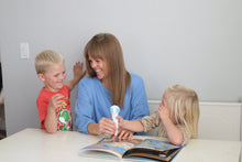 Load image into Gallery viewer, Mother enjoys reading a non-fiction books with her sons. They are listening to the talking pen reading aloud to them, and they are happy 
